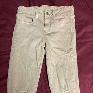 American Eagle Light Pink Ripped Skinny Jeans